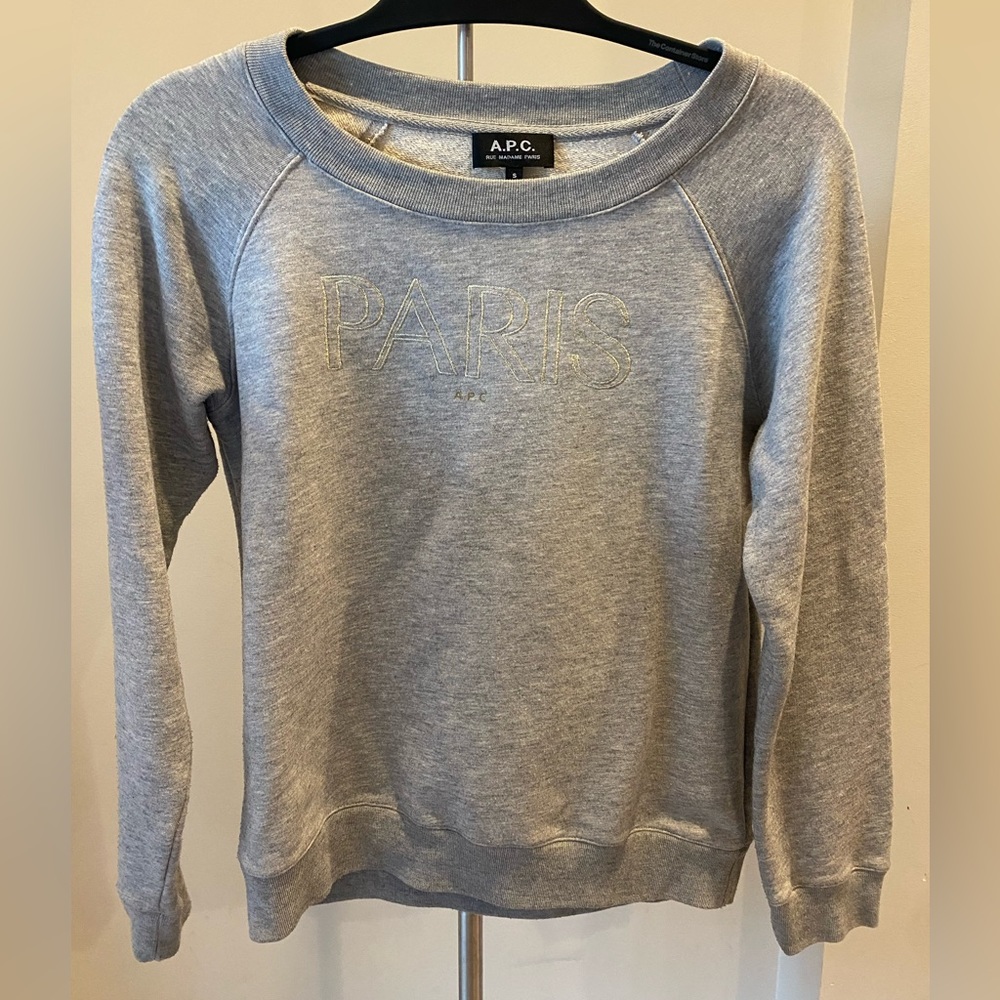 APC light grey sweatshirt with gold embroidered “Paris” lettering.